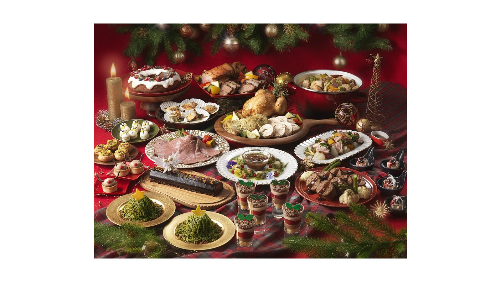 ロースト料理や前菜、クリスマスデザートが並ぶビュッフェ料理イメージ